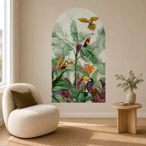 Daylit corner with an arch-shaped tropical wallcovering panel behind a cane chair and side table